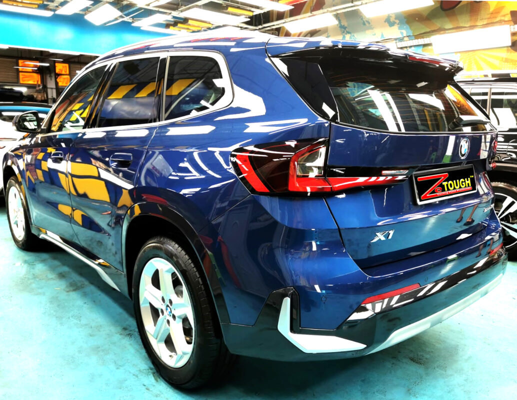 Rear quarter of the BMW X1, glossy and protected.