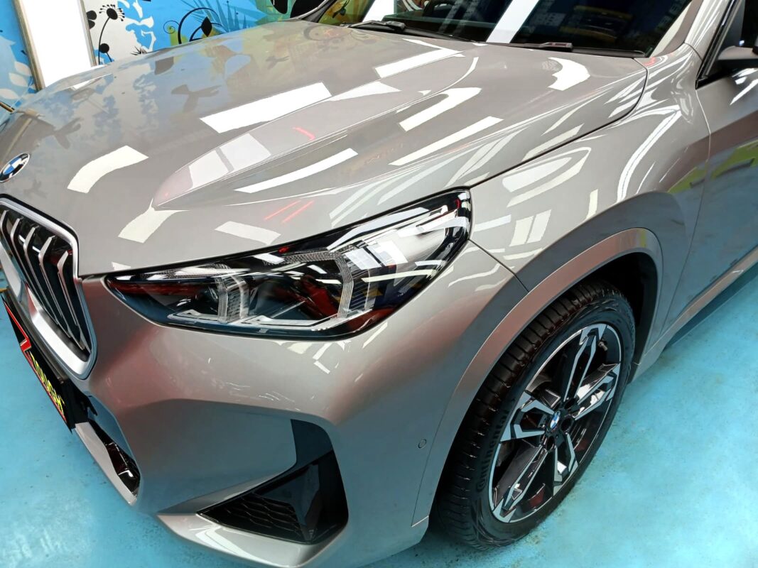 The BMW X1 from a side angle after the ceramic coating.