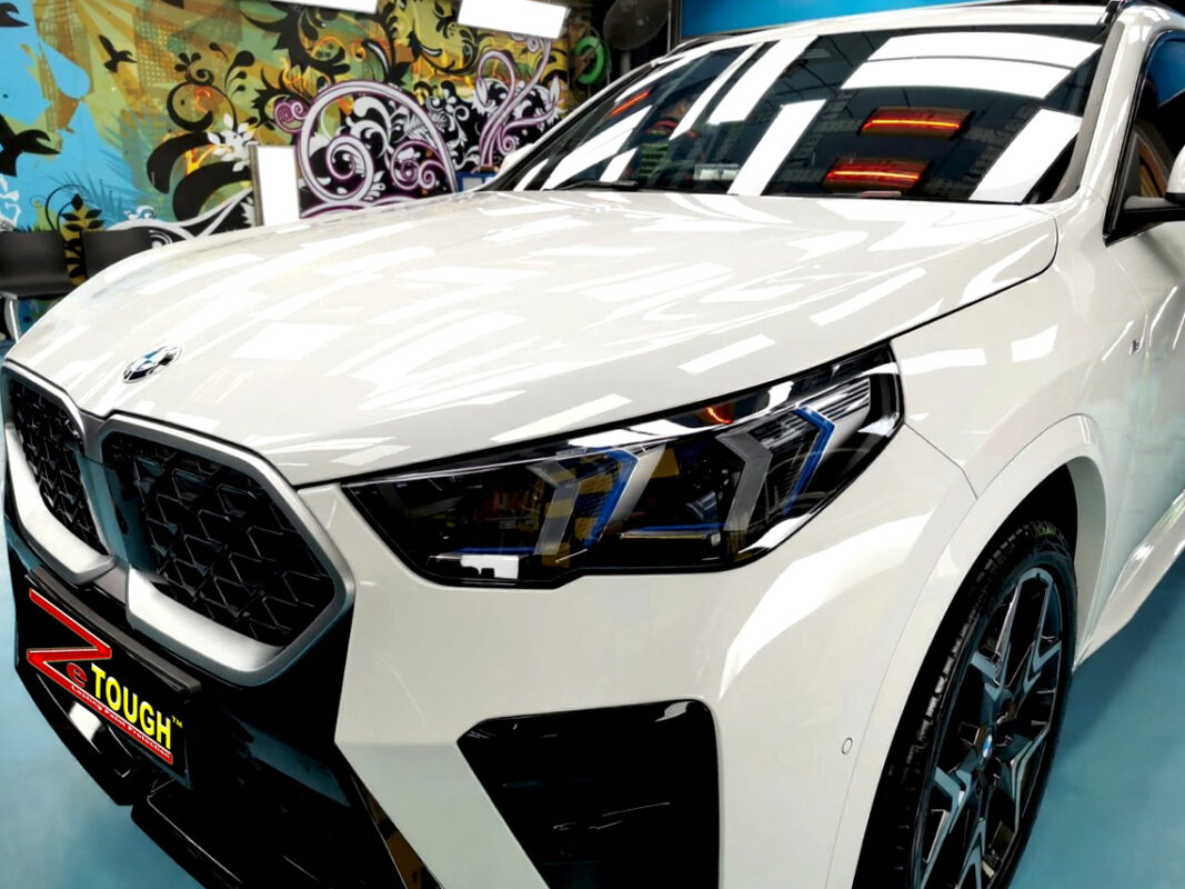 The BMW X2 from a side angle after the ceramic coating.