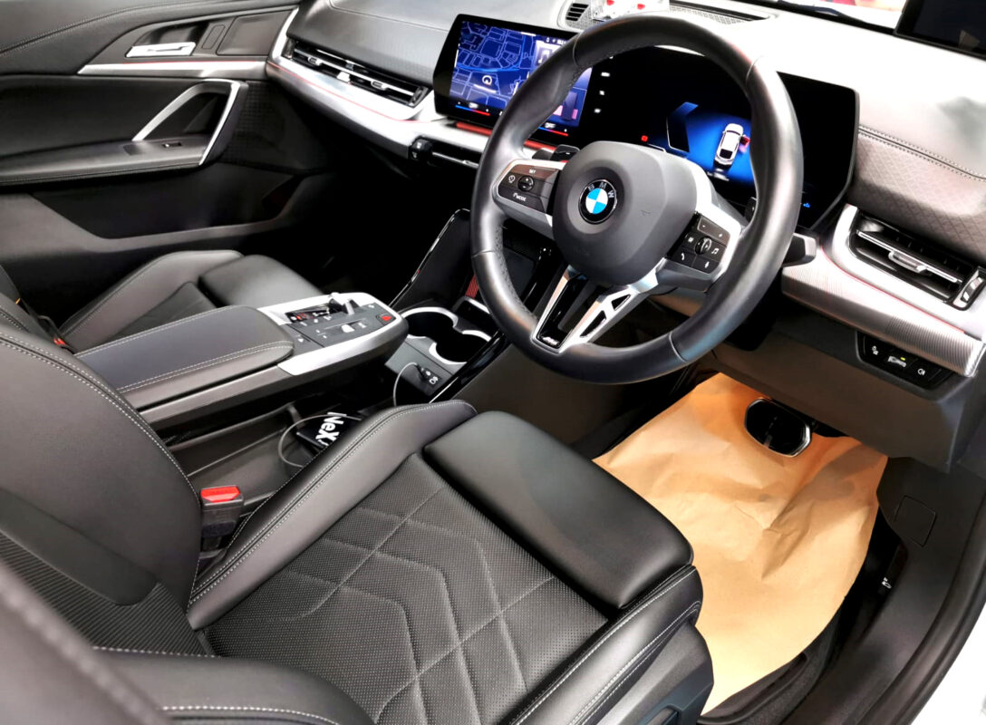 The BMW X2 parked in the workshop, freshly coated.