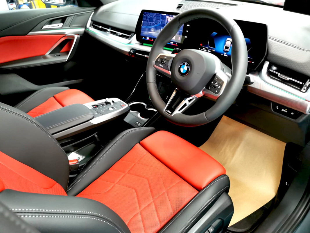 The BMW X2 parked in the workshop, freshly coated.