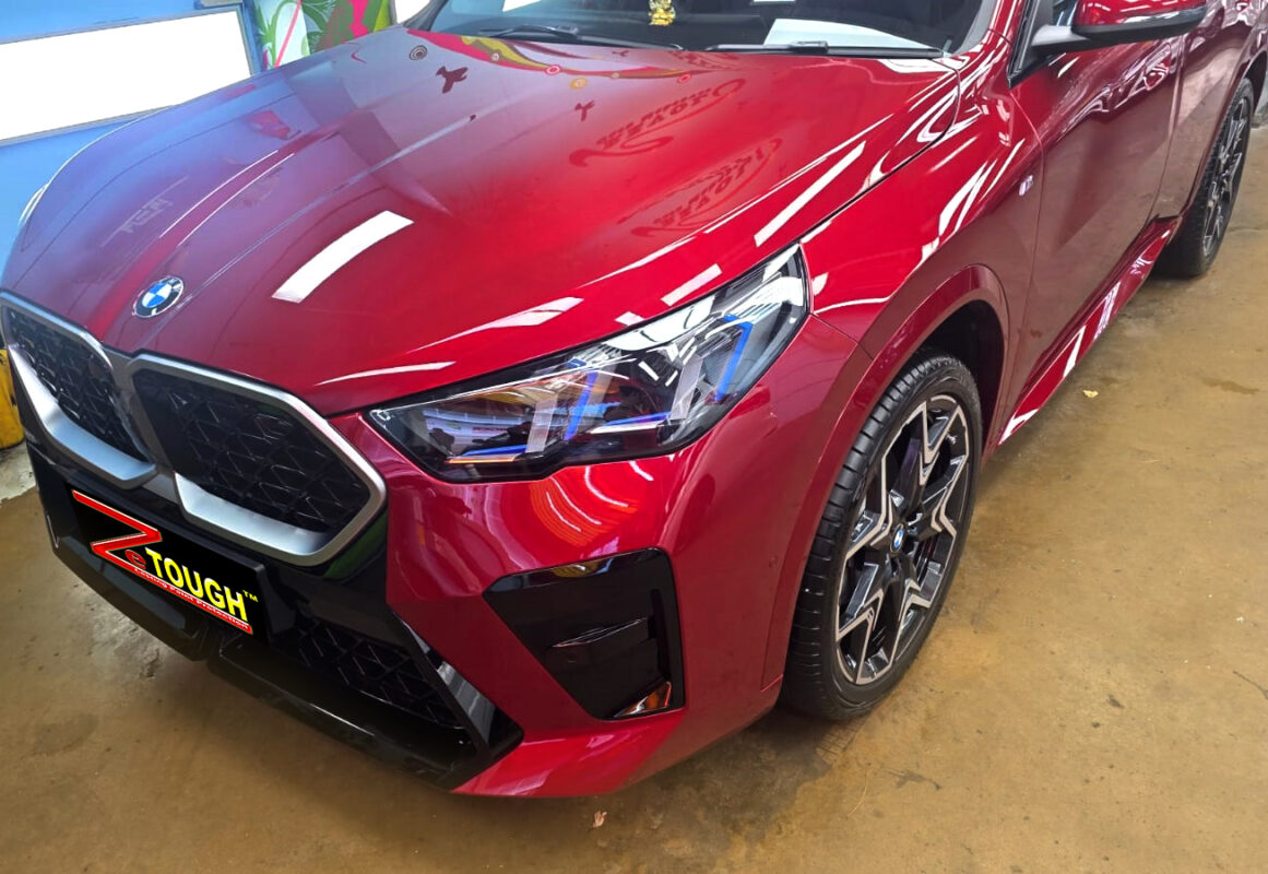 The BMW X2 from a side angle after the ceramic coating.