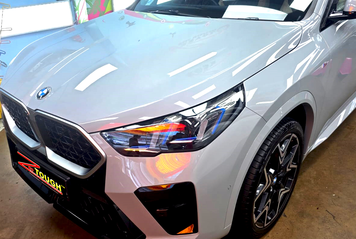 The BMW X2 from a side angle after the ceramic coating.