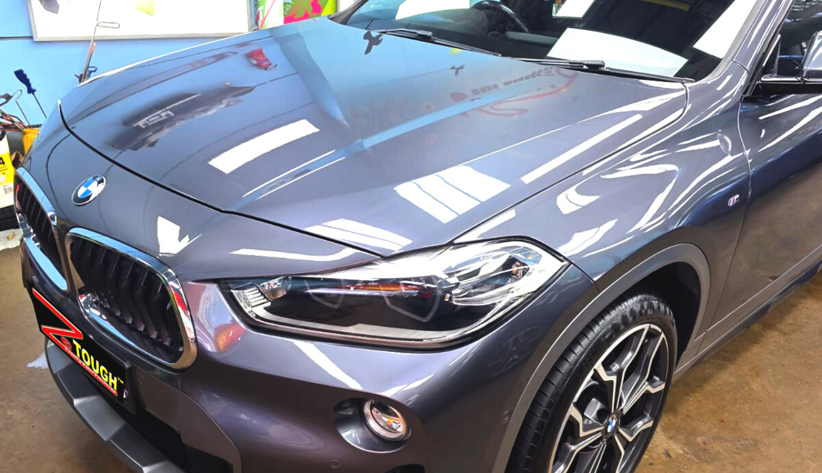 The BMW X2 from a side angle after the ceramic coating.