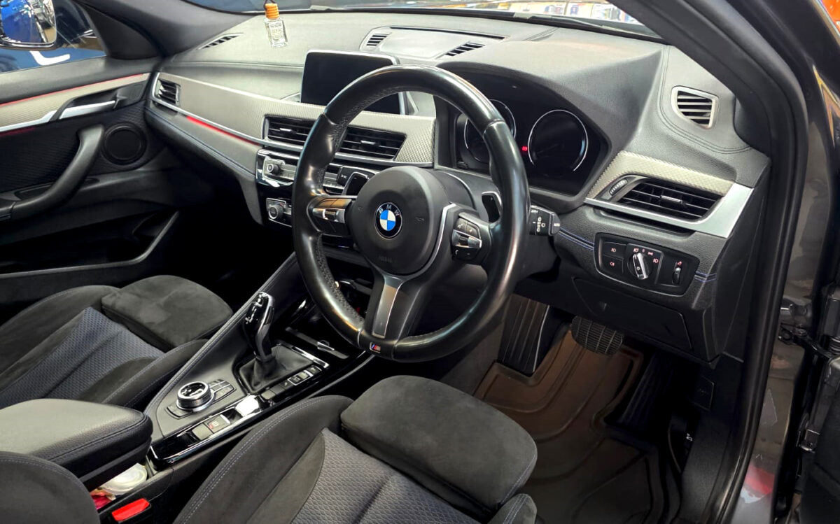 The BMW X2 parked in the workshop, freshly coated.
