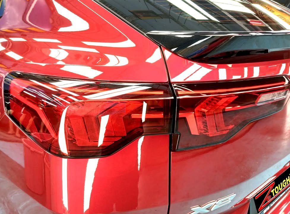 Close-up of the X2 tail light against red paint.