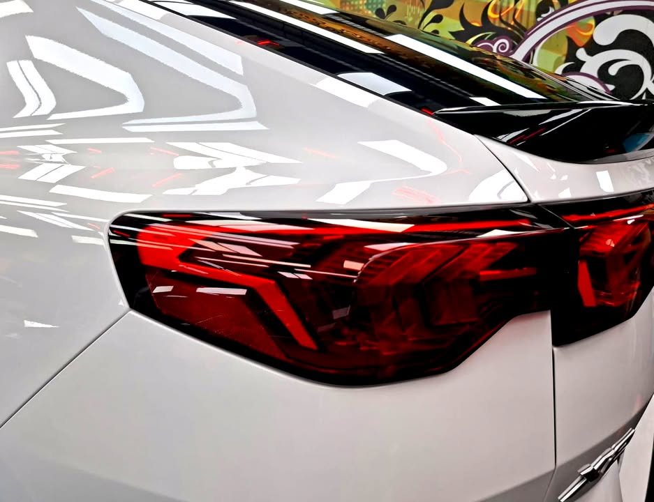 BMW X2 tail light against the white rear quarter.