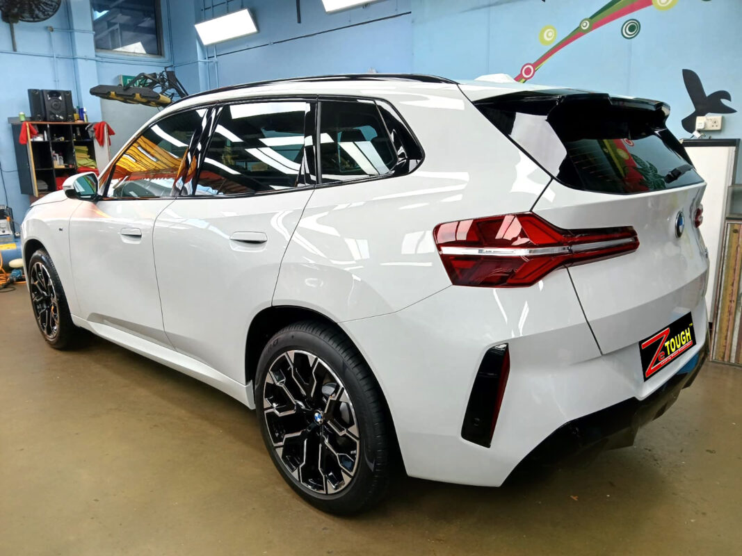Rear quarter of the BMW X3, glossy and protected.