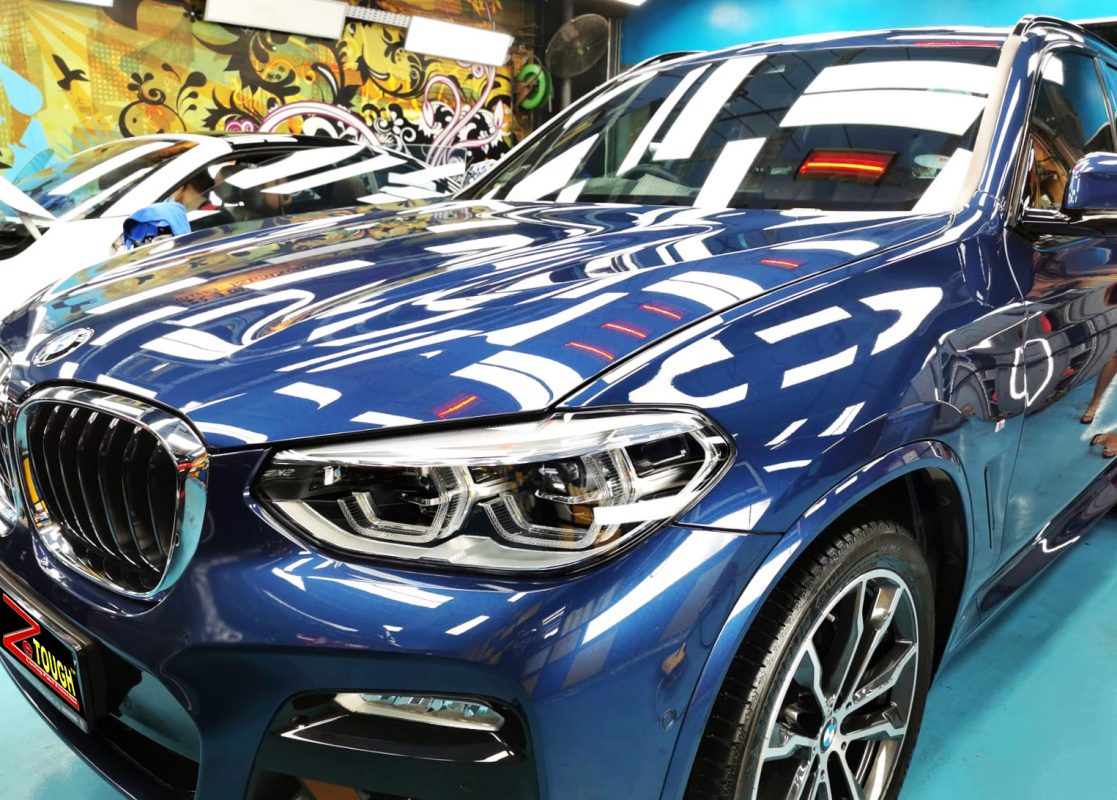 The BMW X3 from a side angle after the ceramic coating.