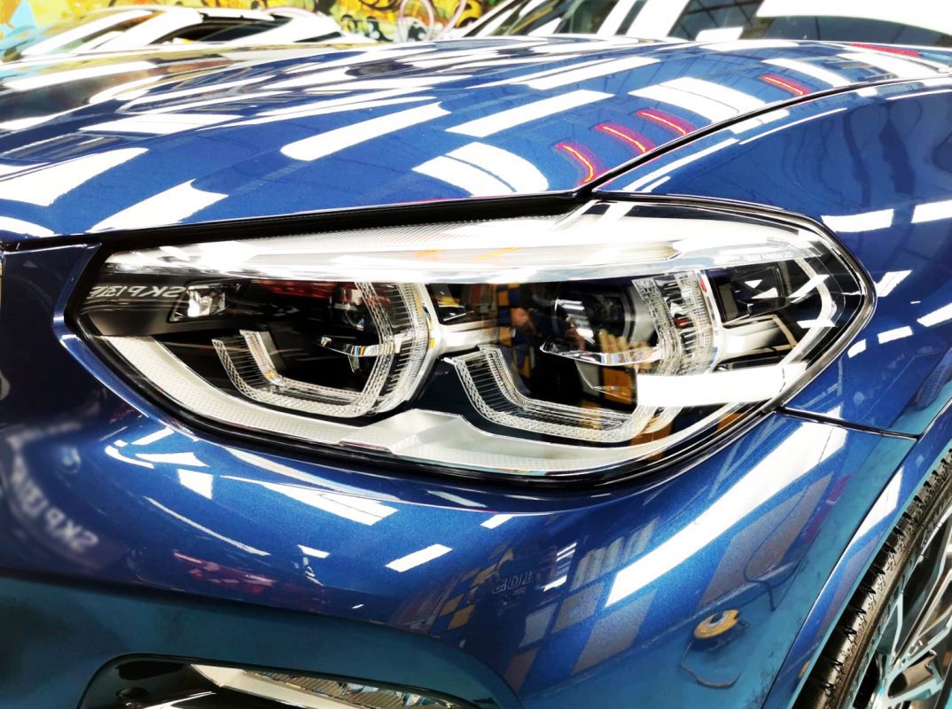 The X3's coated paintwork showing clean reflections.