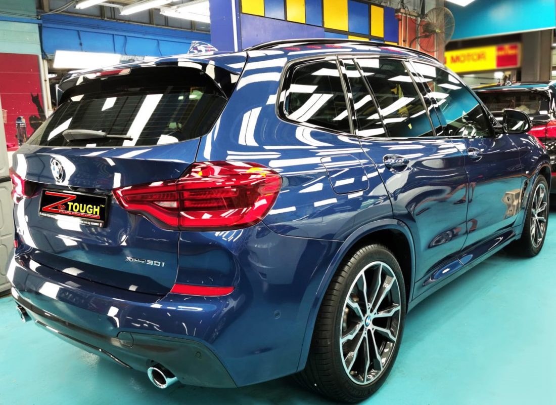 Rear quarter of the BMW X3, glossy and protected.