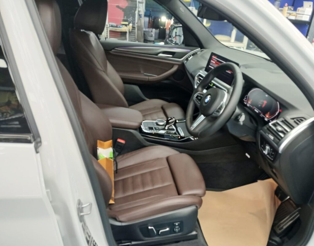 The X3's coated paintwork showing clean reflections.
