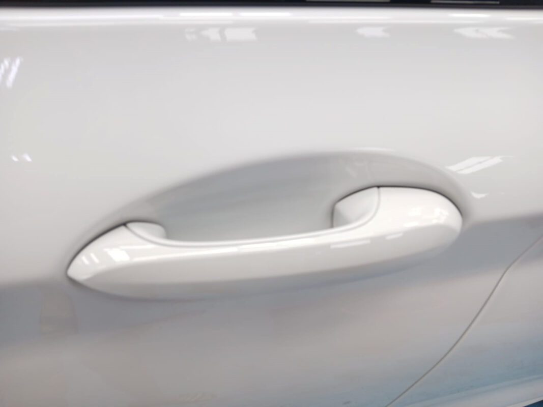 The BMW X3 parked in the workshop, freshly coated.