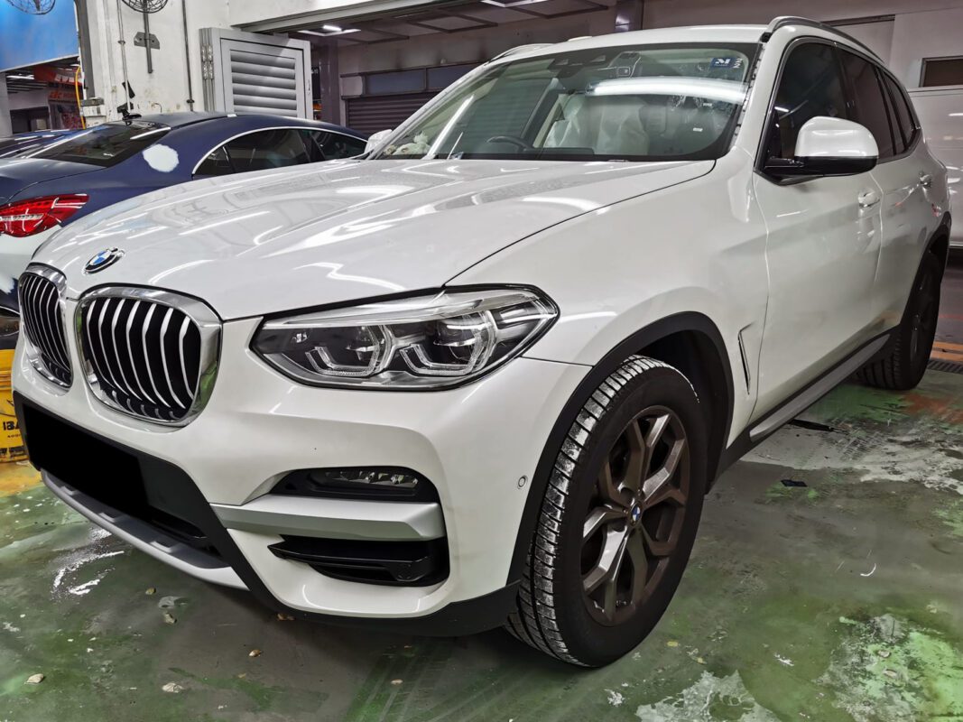 BMW X3 SUV as it arrived at Revol Carz, front three-quarter view before the respray.