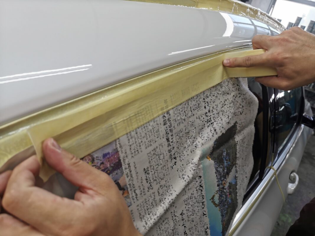 Spraying underway on the BMW X3 inside the booth.