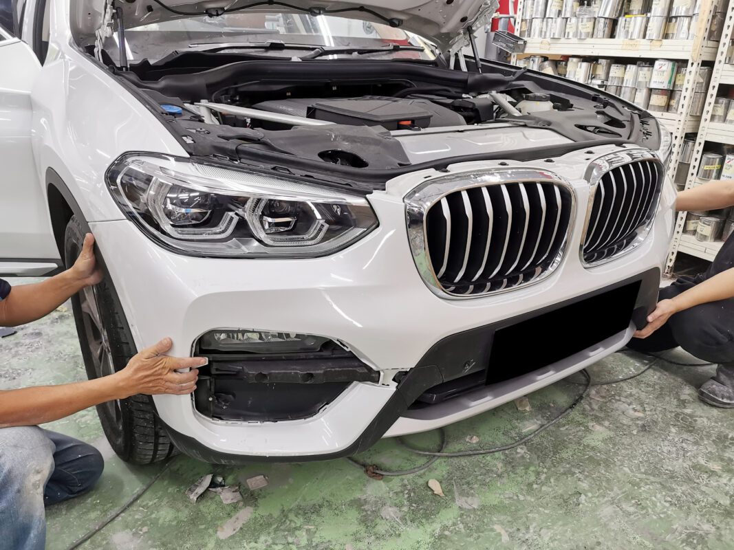 The BMW X3 largely reassembled, paintwork looking smooth and even.
