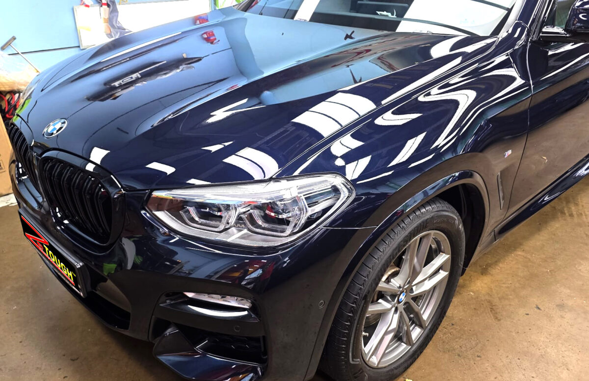 The BMW X3 from a side angle after the ceramic coating.