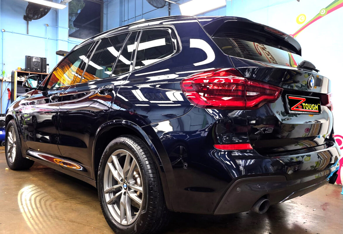 Rear quarter of the BMW X3, glossy and protected.