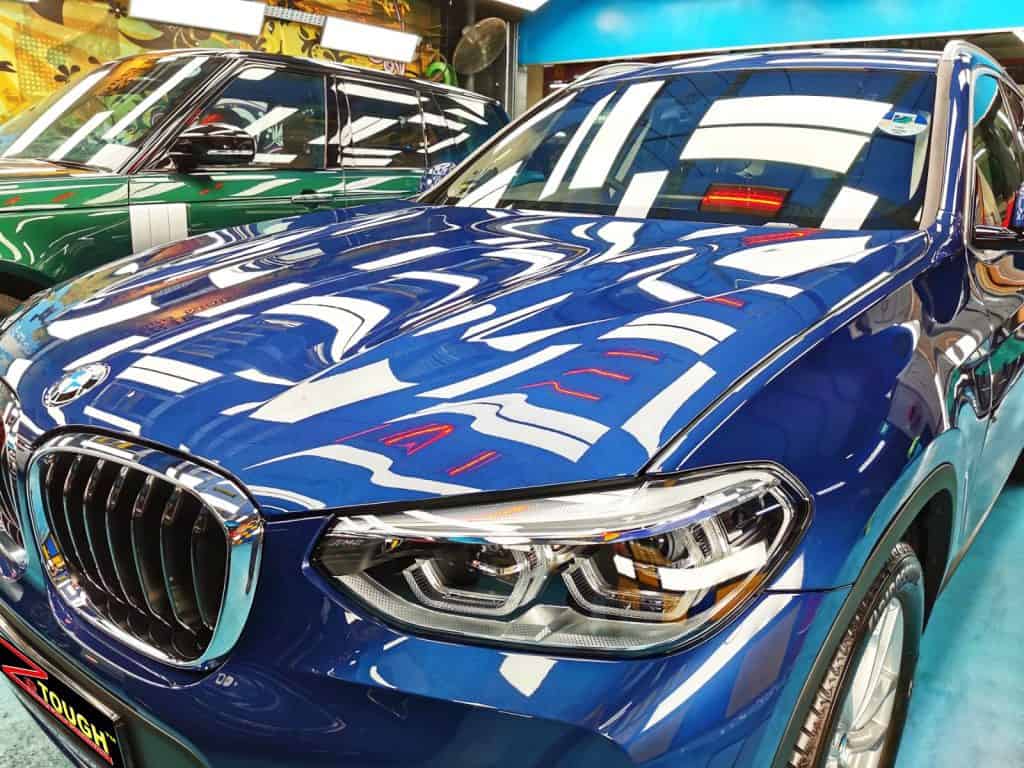 The BMW X3 from a side angle after the ceramic coating.