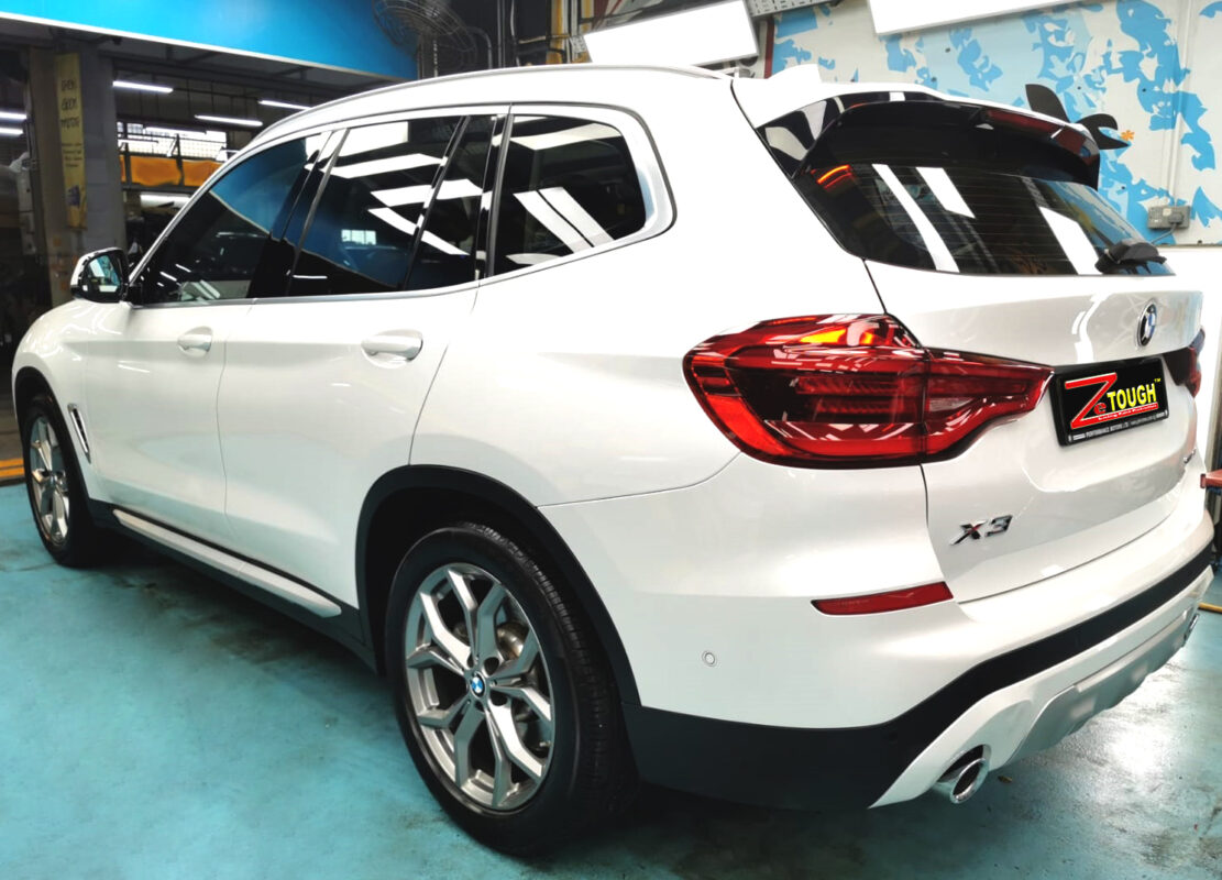 Rear quarter of the BMW X3, glossy and protected.
