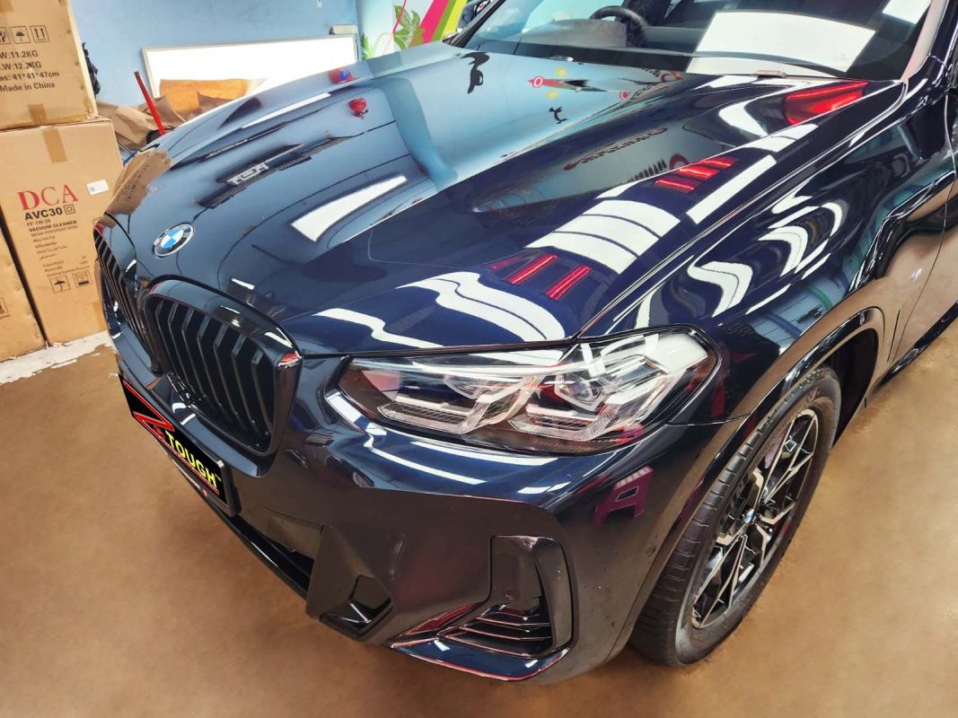 The BMW X3 from a side angle after the ceramic coating.