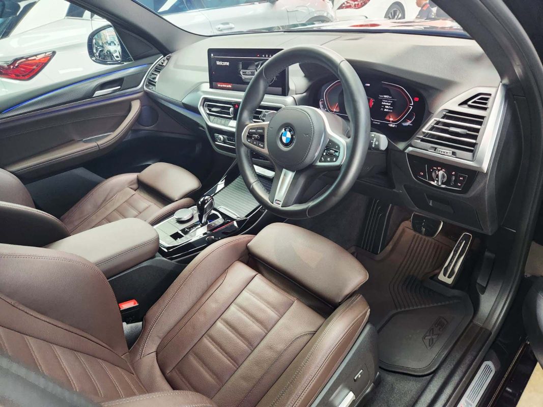 The BMW X3 parked in the workshop, freshly coated.