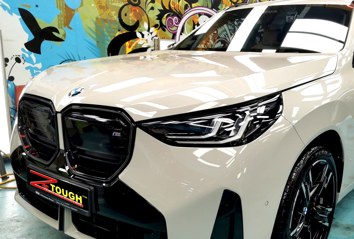 The BMW X3 from a side angle after the titanium coating.
