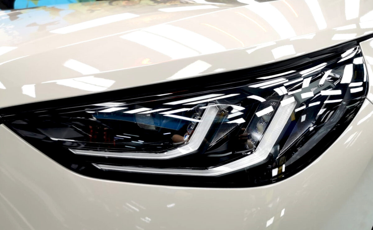The X3's coated paintwork showing clean reflections.