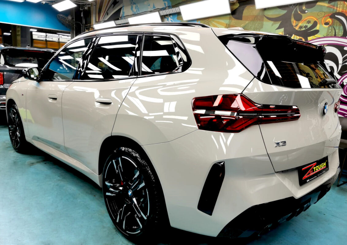 Rear quarter of the BMW X3, glossy and protected.
