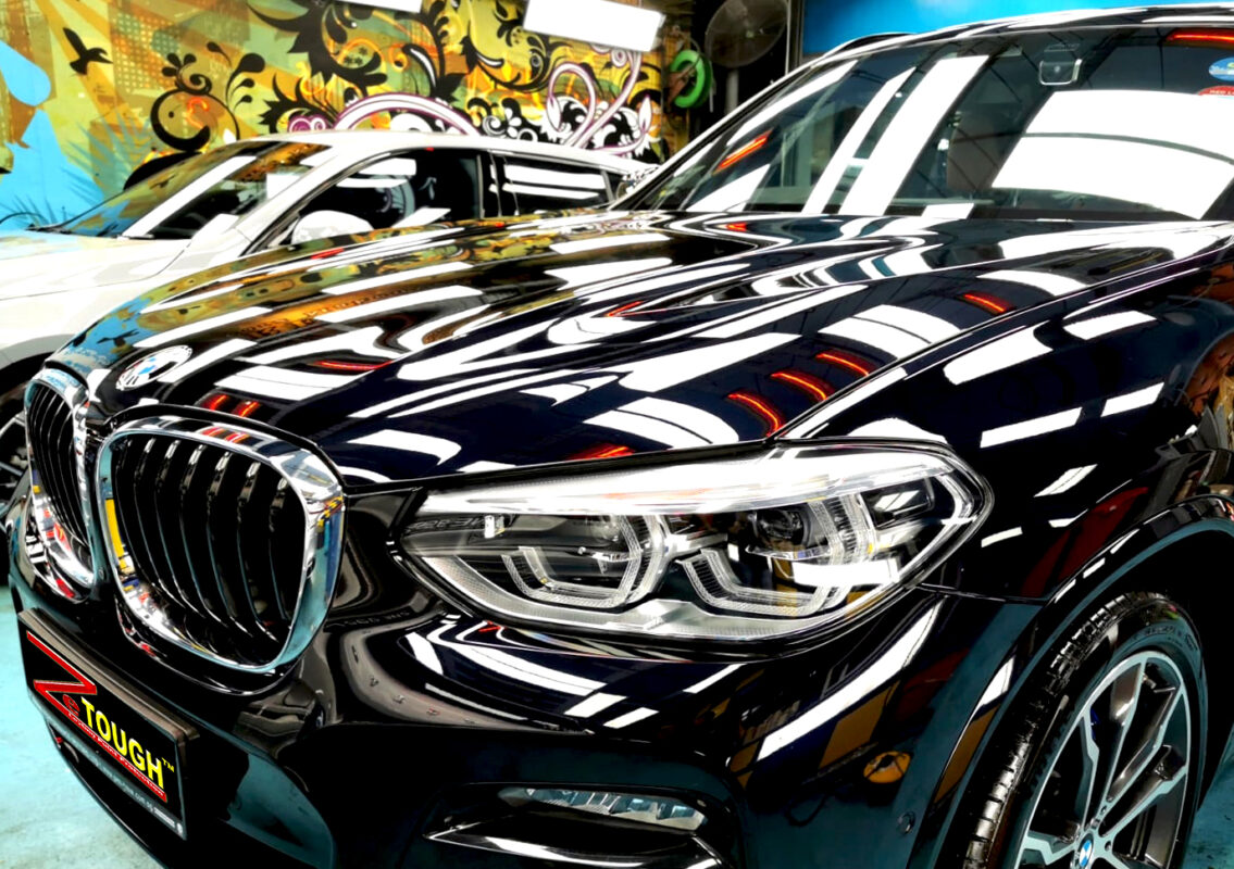 The BMW X3 from a side angle after the ceramic coating.
