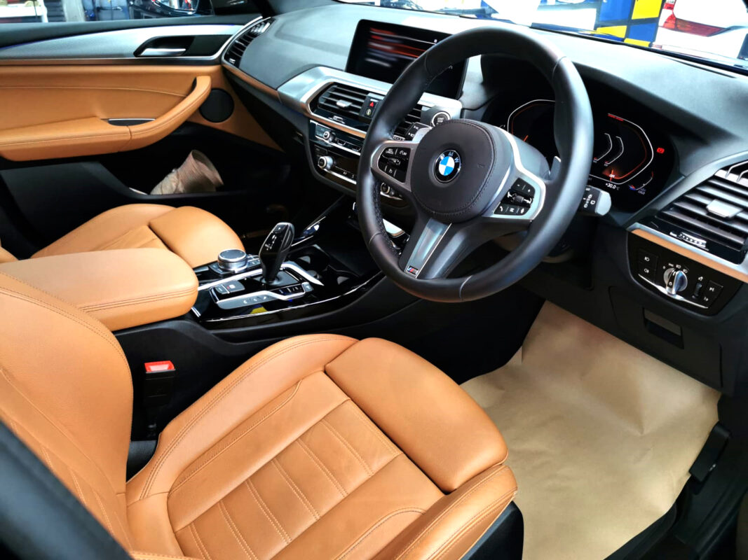 The BMW X3 parked in the AMK AutoPoint workshop, freshly coated.