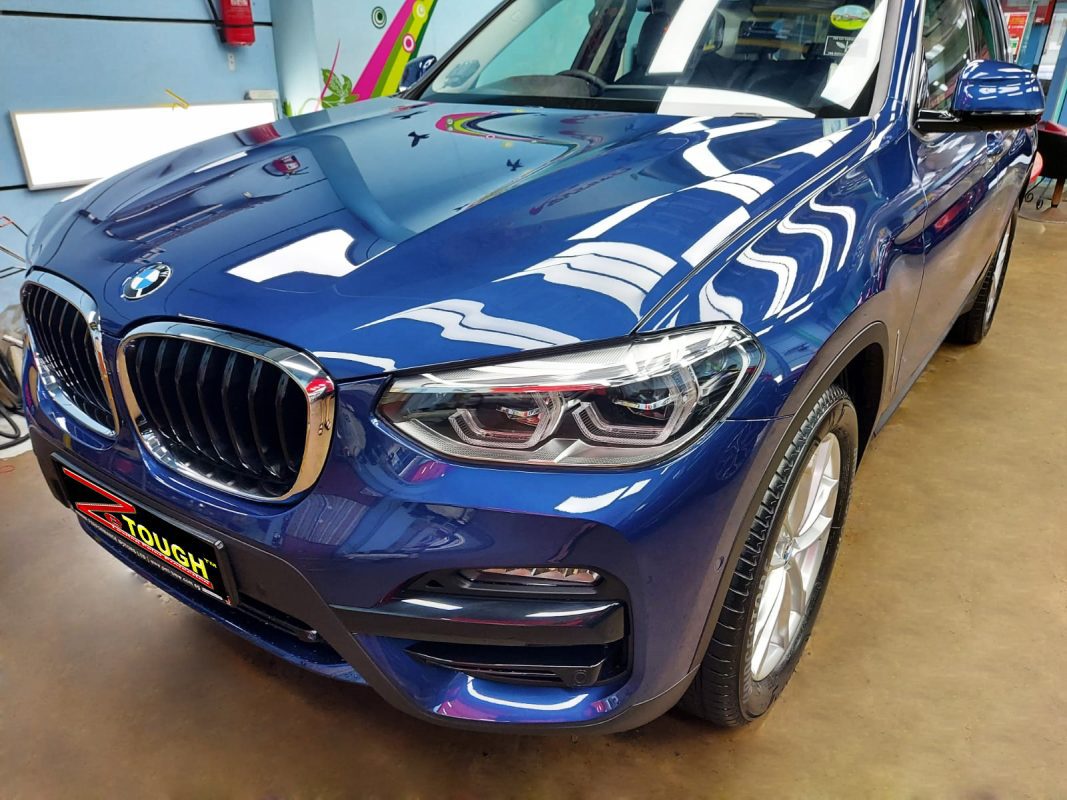 The BMW X3 from a side angle after the titanium coating.