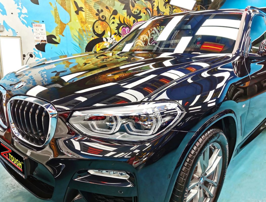 The BMW X3 from a side angle after the titanium coating.