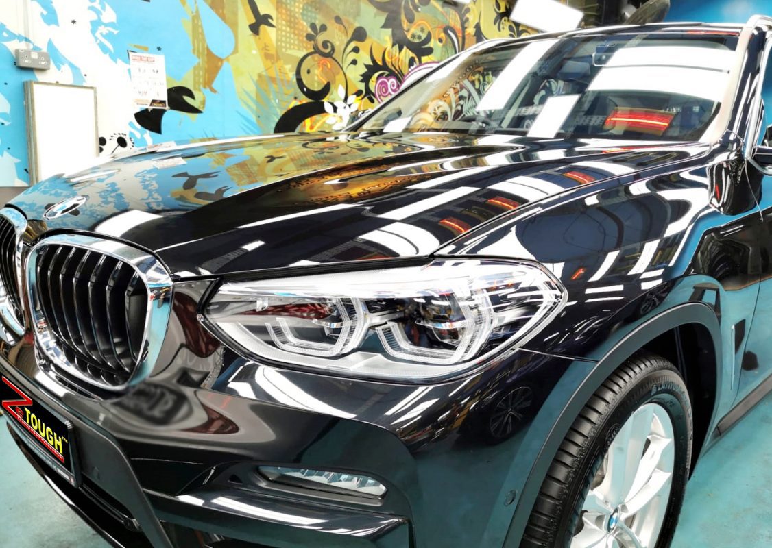 The BMW X3 from a side angle after the ceramic coating.
