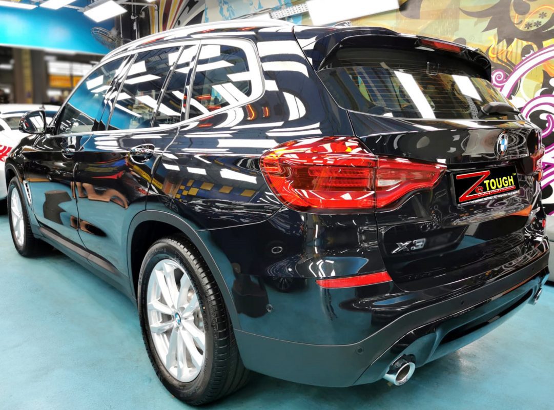 Rear quarter of the BMW X3, glossy and protected.