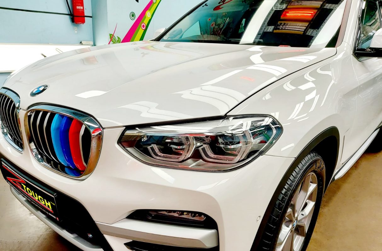 The BMW X3 from a side angle after the titanium coating.