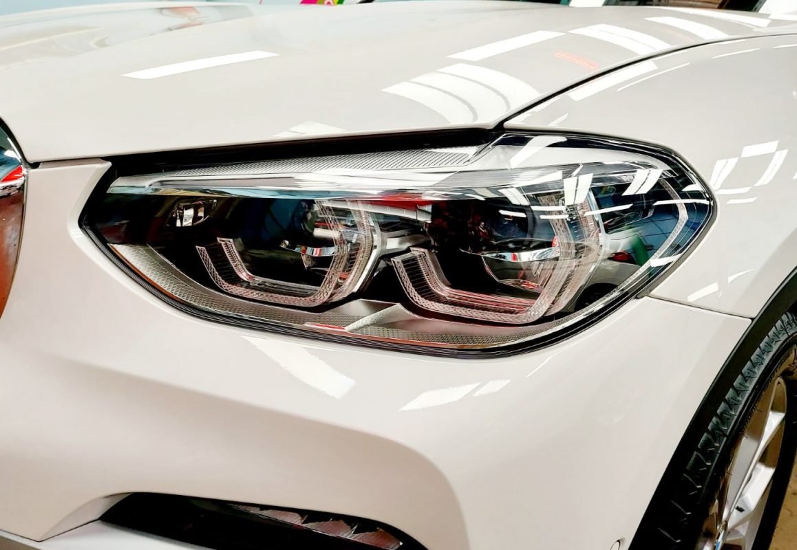 The X3's coated paintwork showing clean reflections.