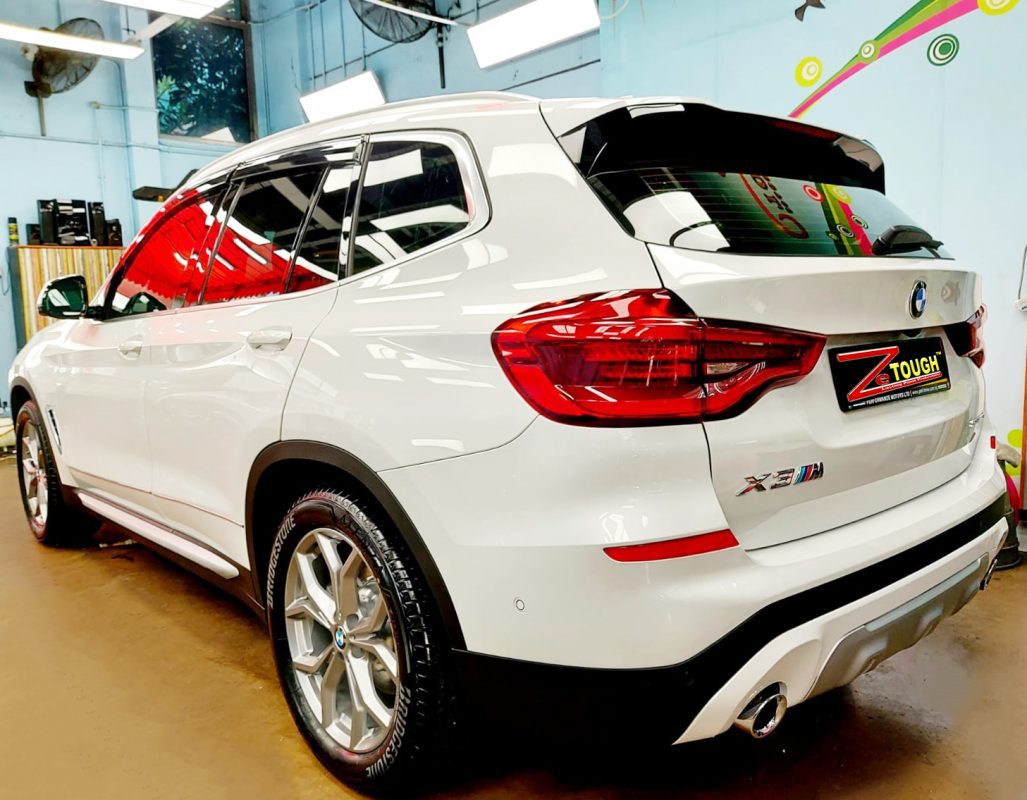 Rear quarter of the BMW X3, glossy and protected.