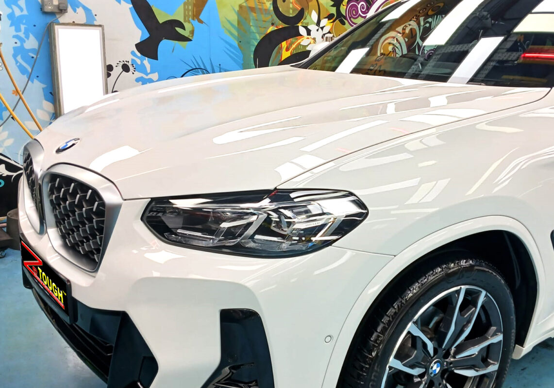 The BMW X4 from a side angle after the titanium coating.