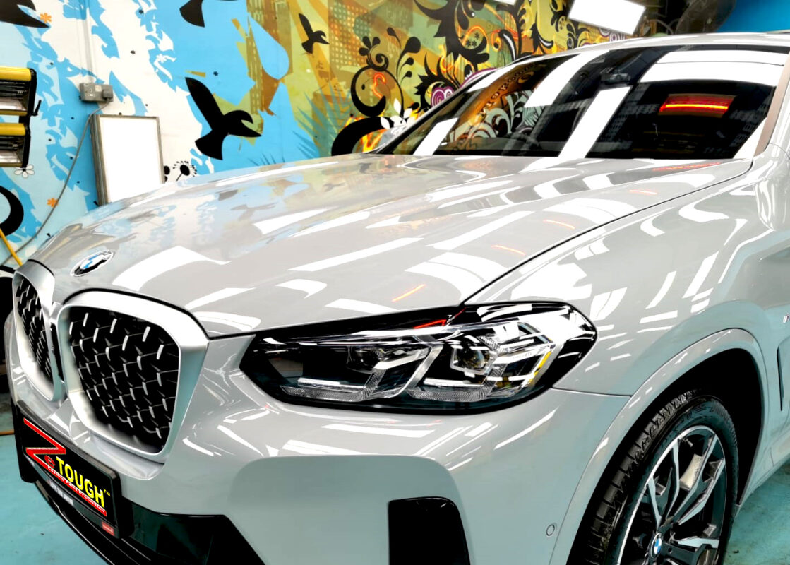 The BMW X4 from a side angle after the ceramic coating.