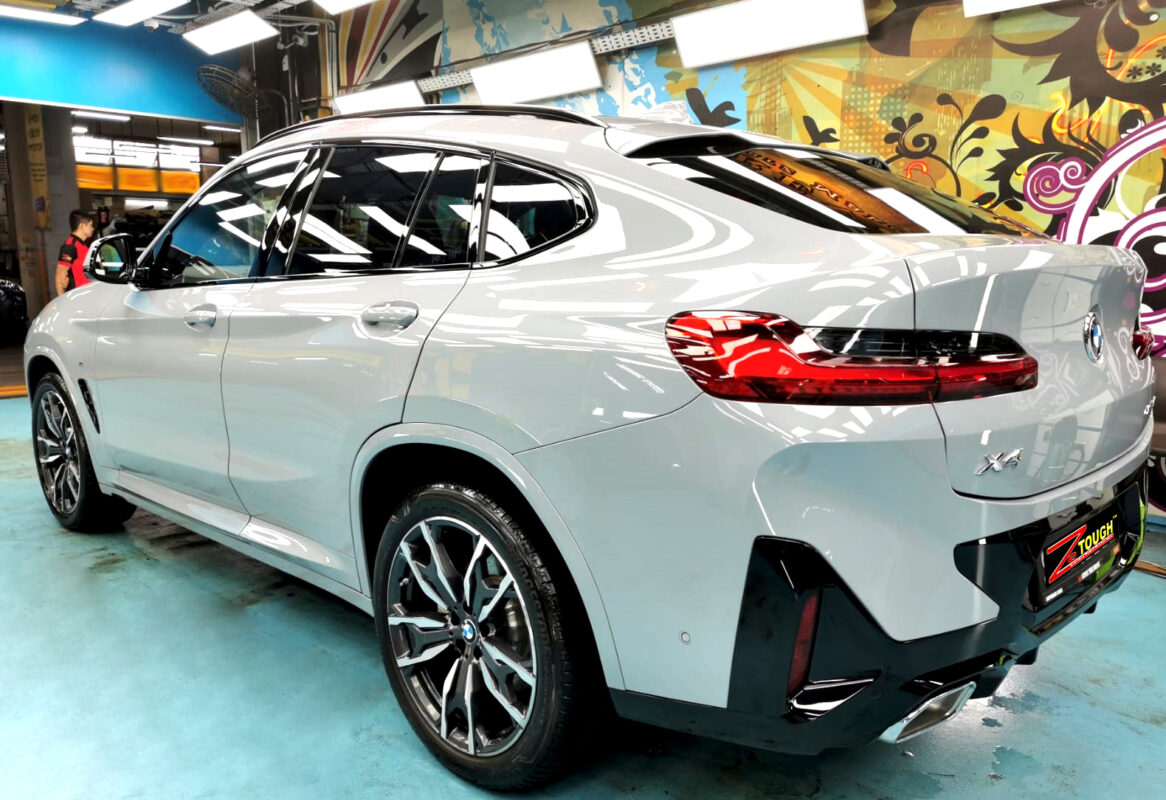 Rear quarter of the BMW X4, glossy and protected.