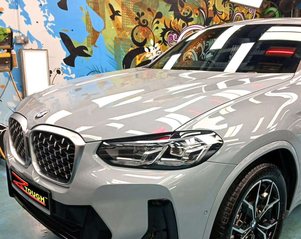 The BMW X4 from a side angle after the titanium coating.