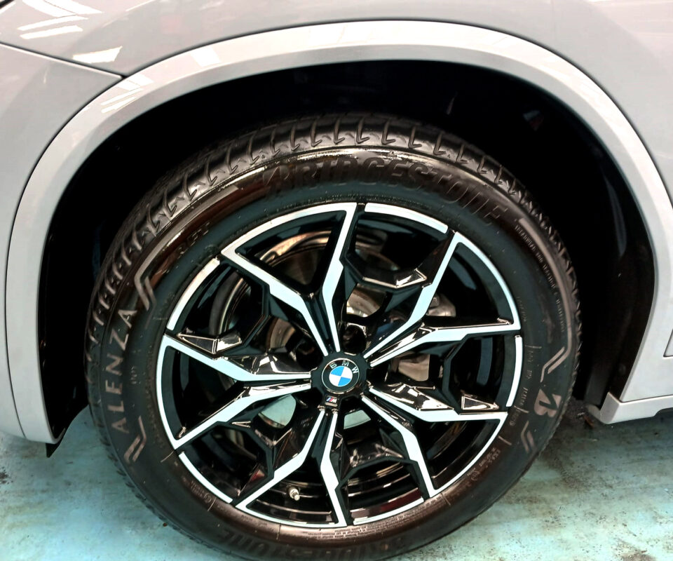 Rear quarter of the BMW X4, glossy and protected.