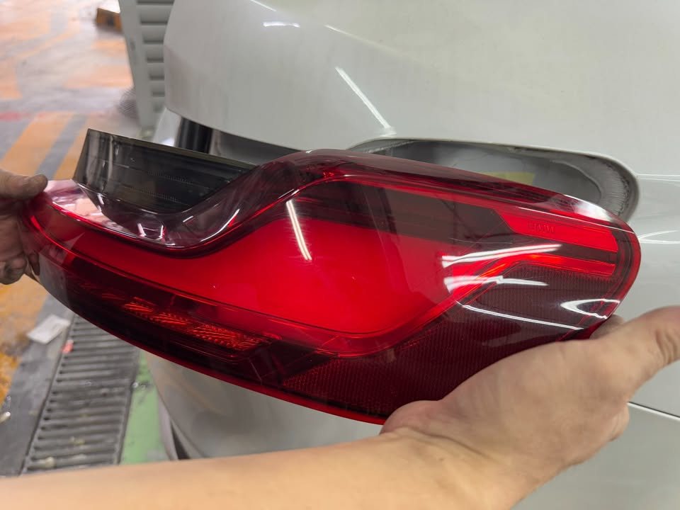 Red tail lamp held up after removal from the X4.