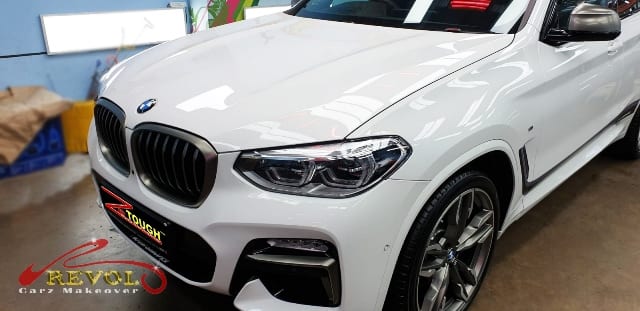 The BMW X4 M40i from a side angle after the titanium coating.