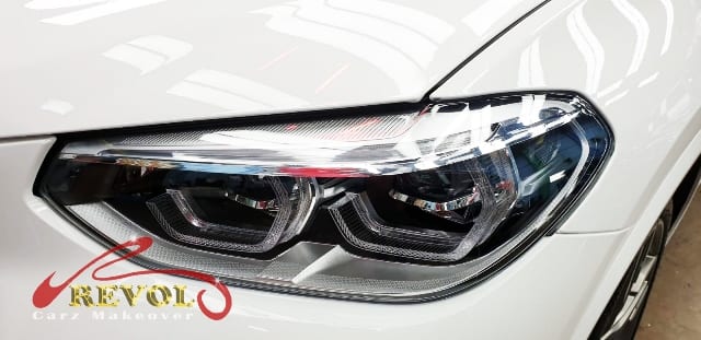The M40i's coated paintwork showing clean reflections.