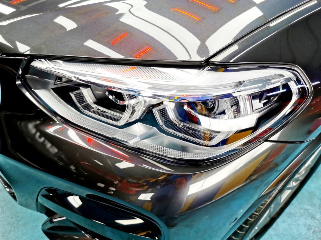 The X4's coated paintwork showing clean reflections.