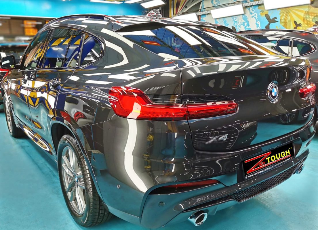 Rear quarter of the BMW X4, glossy and protected.