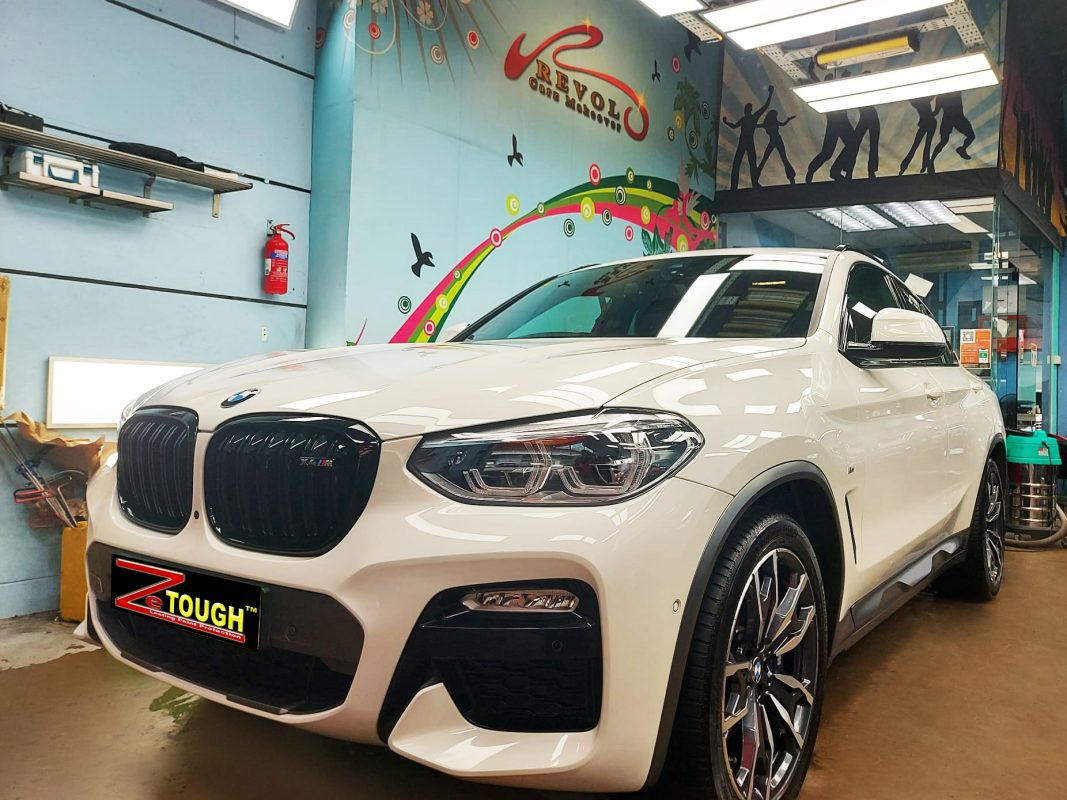 The X4's coated paintwork showing clean reflections.