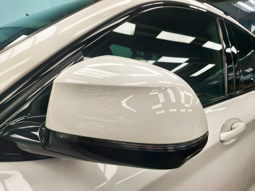 Rear quarter of the BMW X4, glossy and protected.